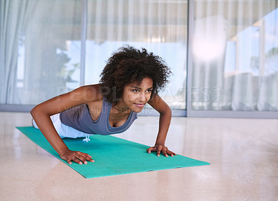 Buy stock photo Woman, fitness and push up for training, exercise and wellness with muscle health on floor at home or outdoor. Young and african person with shoulder or arm workout, planking or pilates for strength