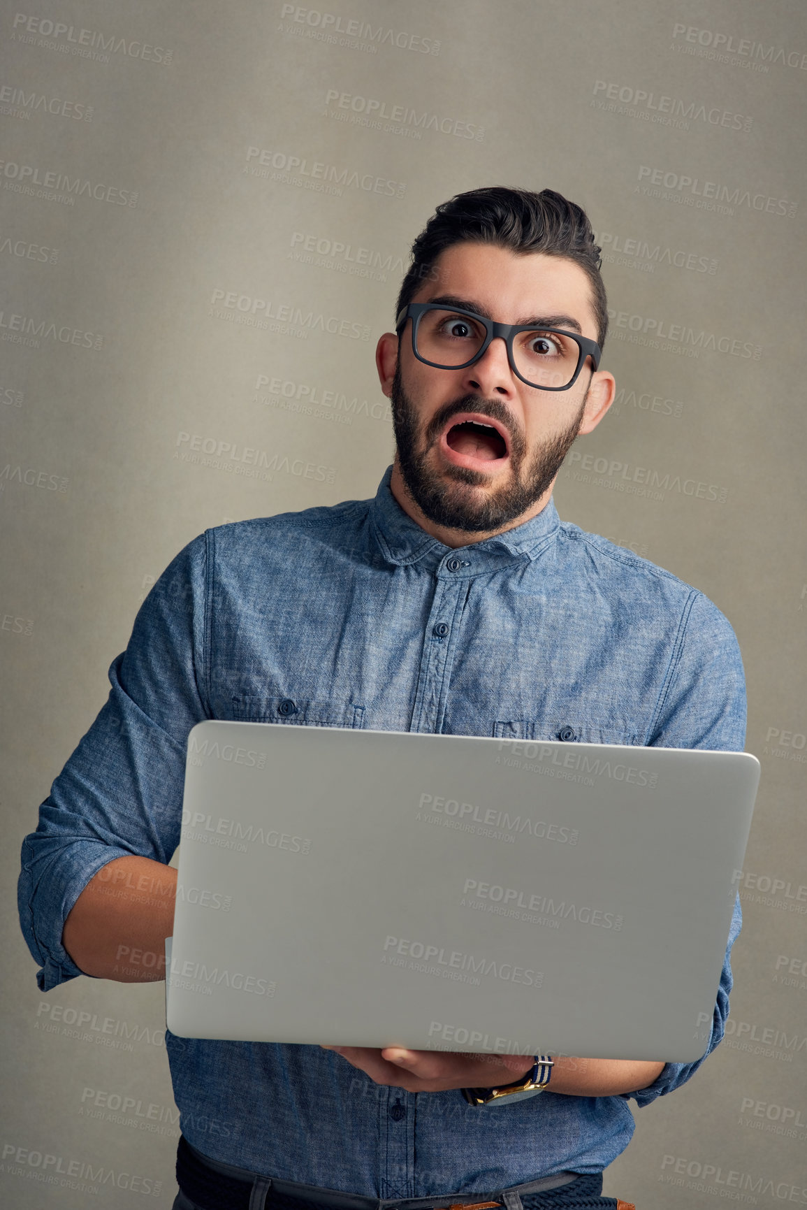 Buy stock photo Shock, surprise and portrait of businessman on laptop in studio with bad news, notification or email mistake. Professional, crisis and person on gray background with wtf, omg and confused on computer