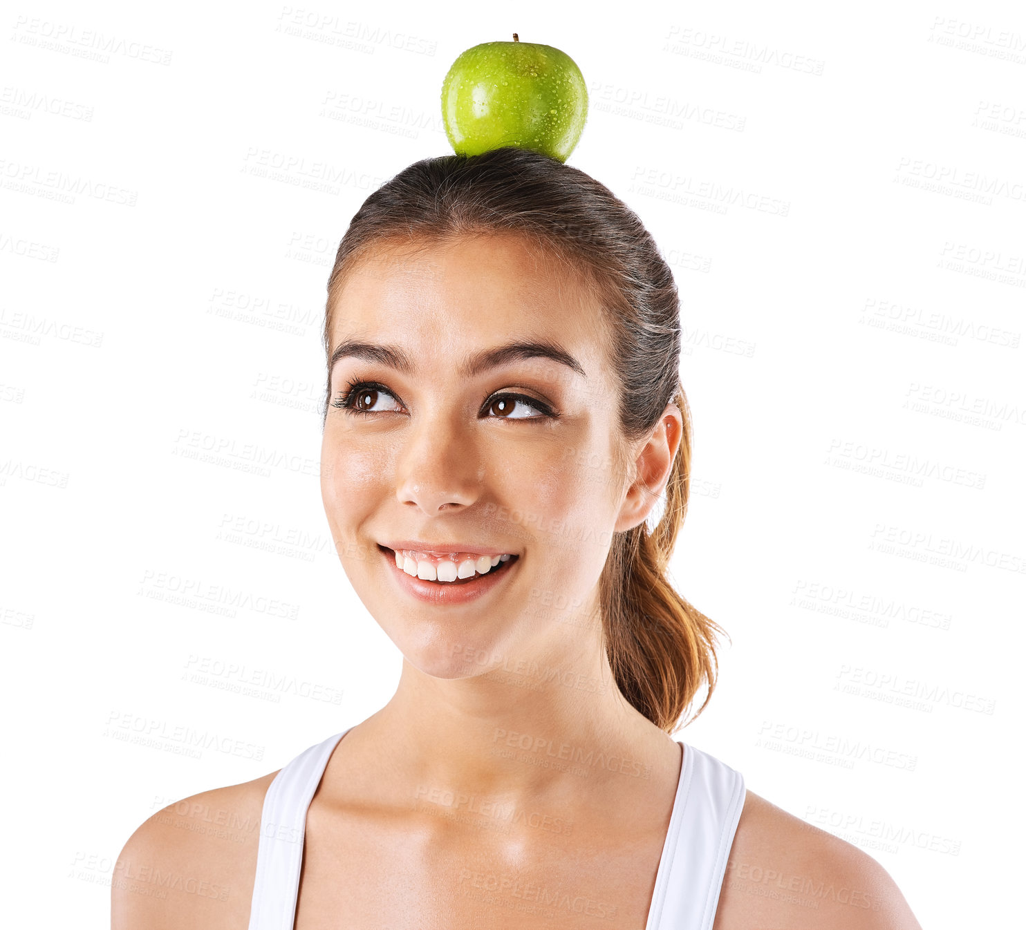 Buy stock photo Cropped shot of a woman posing with an apple on her head