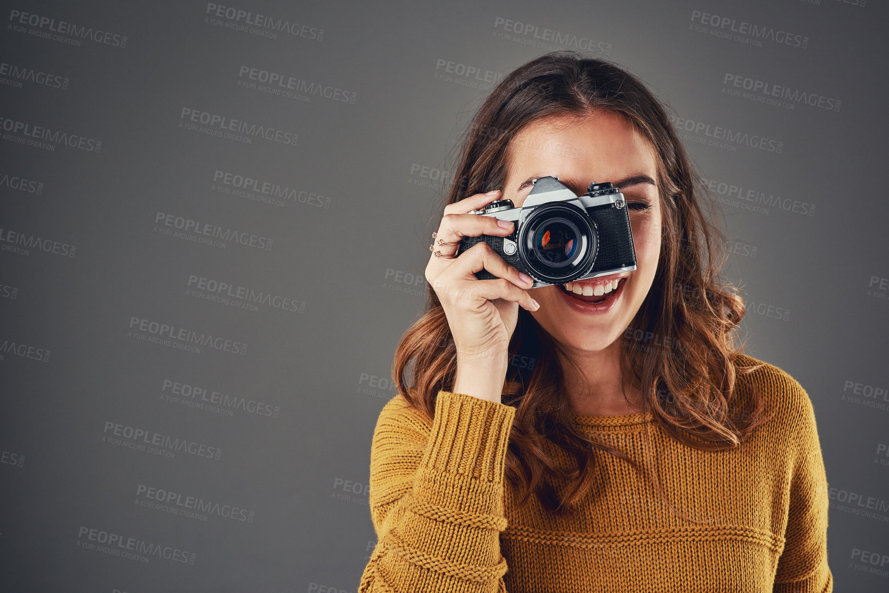 Buy stock photo Woman, portrait and photographer with camera for picture, memory and professional in studio mockup. Student, happy and photography equipment for creativity, portfolio and space by gray background