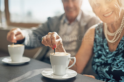 Buy stock photo Coffee, love and senior couple on smile and bonding in retirement, happy and together in cafe. Hands, drink and elderly people in commitment of marriage, woman and man in old age and pension