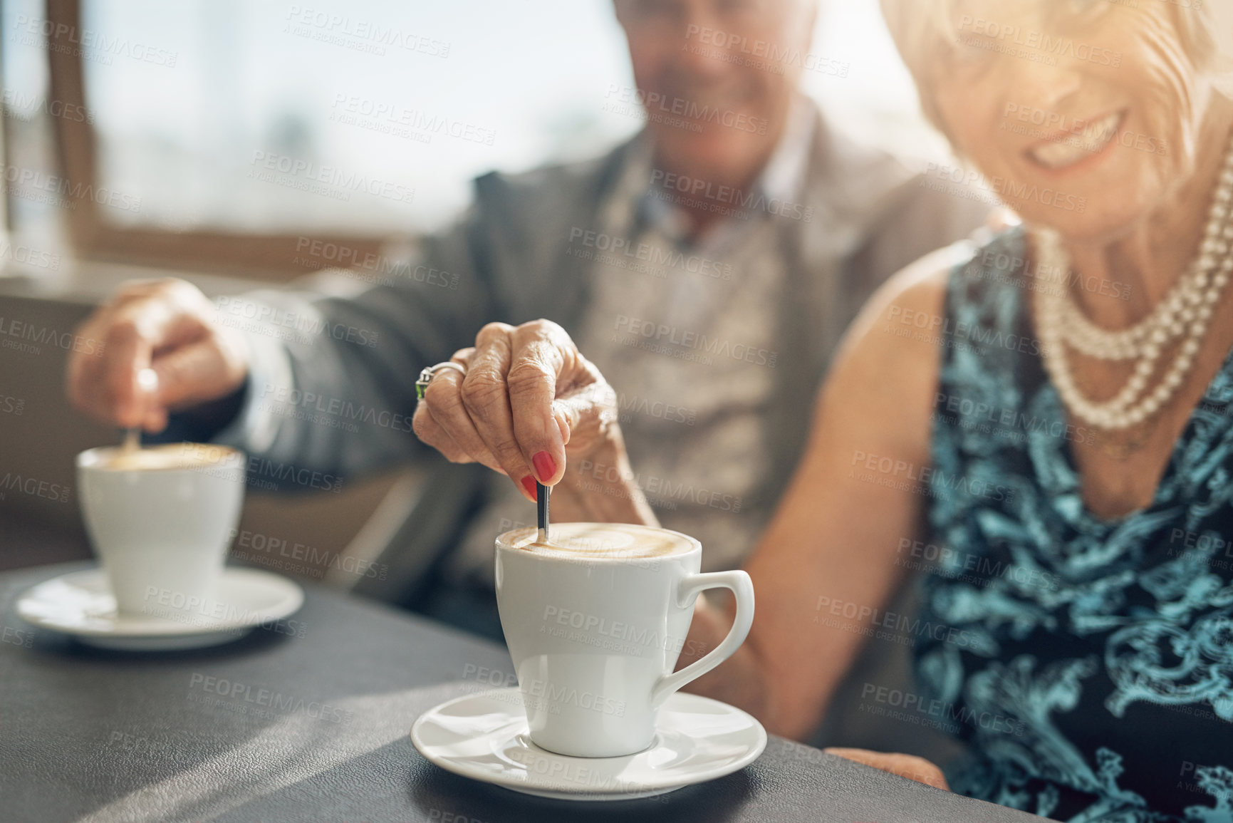 Buy stock photo Coffee, love and senior couple on smile and bonding in retirement, happy and together in cafe. Hands, drink and elderly people in commitment of marriage, woman and man in old age and pension