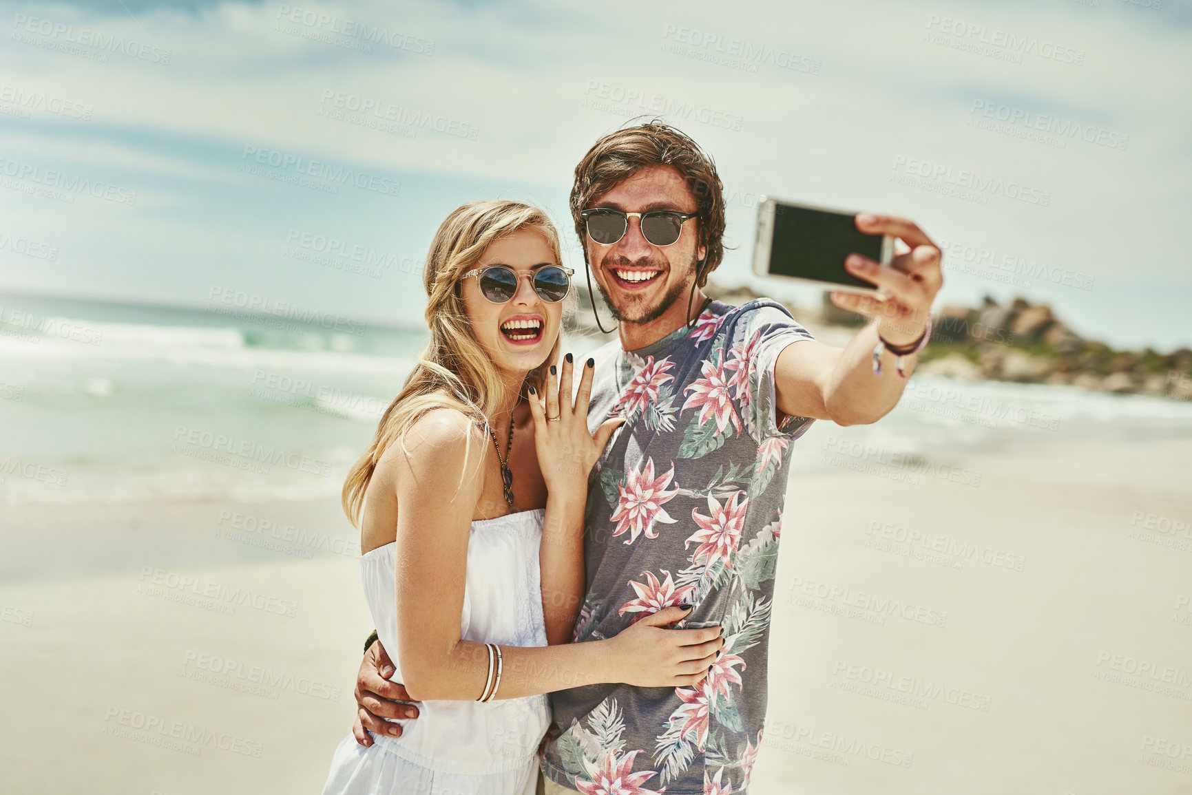 Buy stock photo Couple, selfie and smile for engagement at beach on holiday, vacation and profile picture update. Excited people, video call or live streaming on social media for proposal celebration or love in Bali