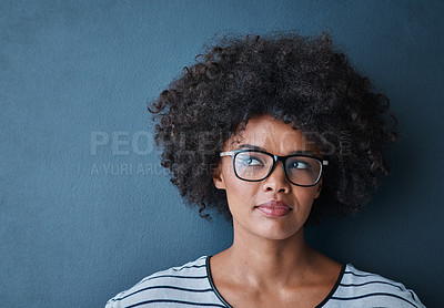 Buy stock photo Optometry, eye care and woman with glasses in studio with thinking, pensive or idea face expression. Optical wellness, healthcare and African female model with spectacles isolated by blue background.