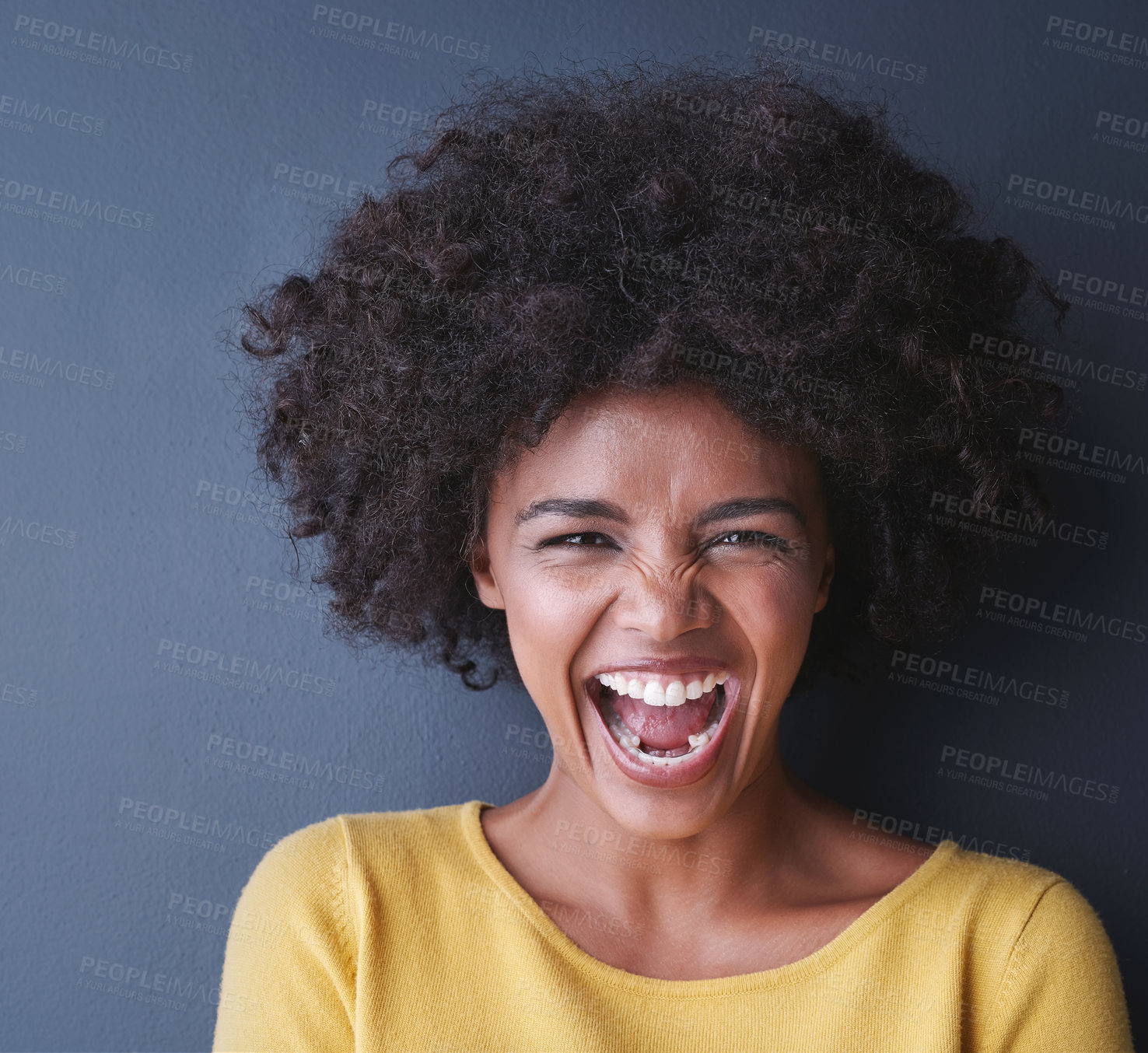 Buy stock photo Laughing, black woman and portrait in studio with happiness, comedy or freedom in mockup space. Happy, face and African lady smile, emoji or crazy reaction to joke or humor on grey background