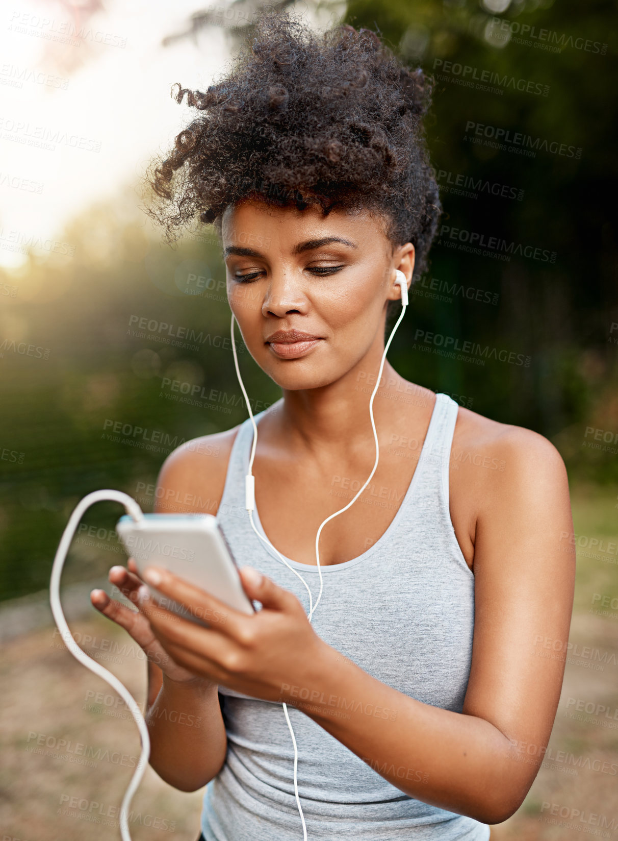 Buy stock photo Fitness, black woman and smartphone with earphones for  music, podcast and radio with smile. Nature, female runner and mobile to listening audio track, song and playlist for motivation outdoor