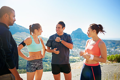 Buy stock photo Cropped shot of a fitness group out for a run together