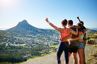 Buy stock photo Rear view shot of a fitness group celebrating after a workout outside