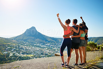 Buy stock photo Rear view shot of a fitness group celebrating after a workout outside