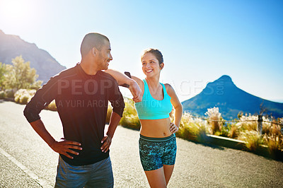 Buy stock photo Cropped shot of a sporty young couple out for a run together