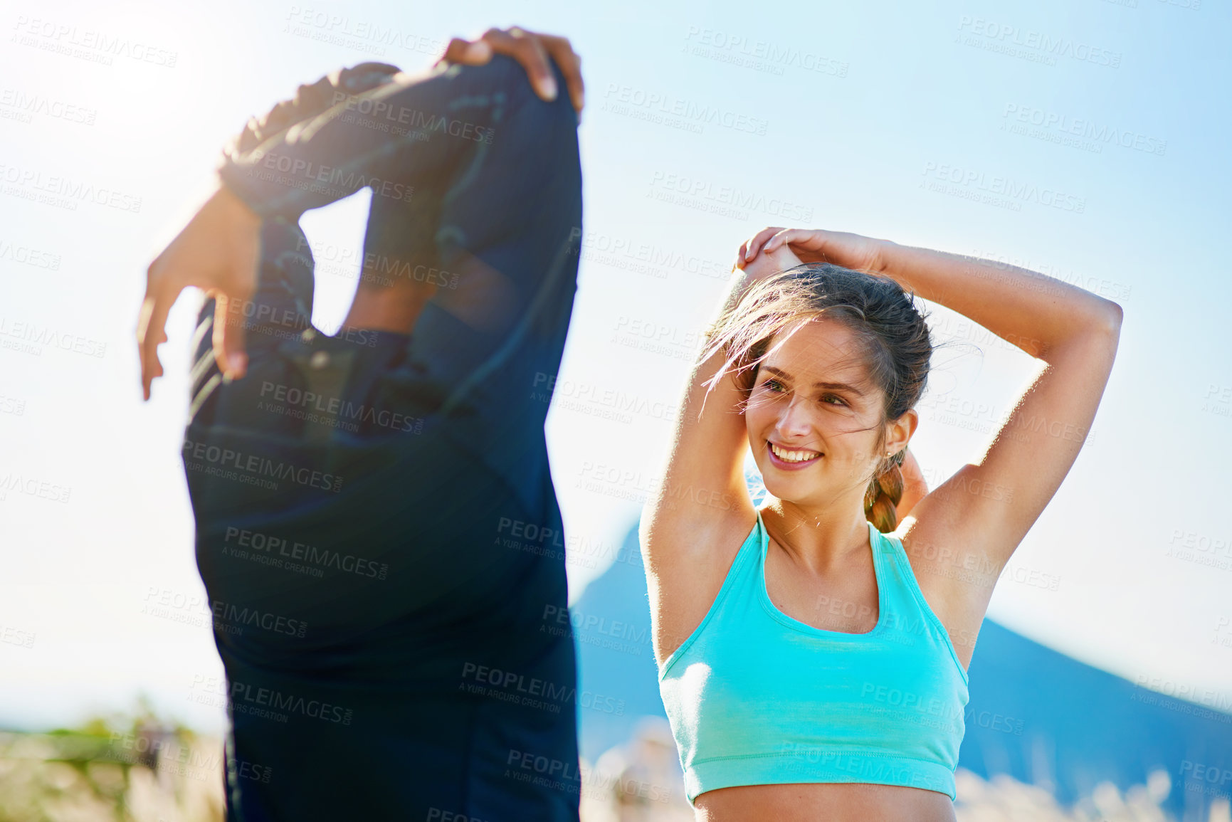 Buy stock photo Stretching, man and woman in nature for fitness, support and happy morning body training together. Warm up, athlete girl and personal trainer on mountain for outdoor workout, challenge or coaching