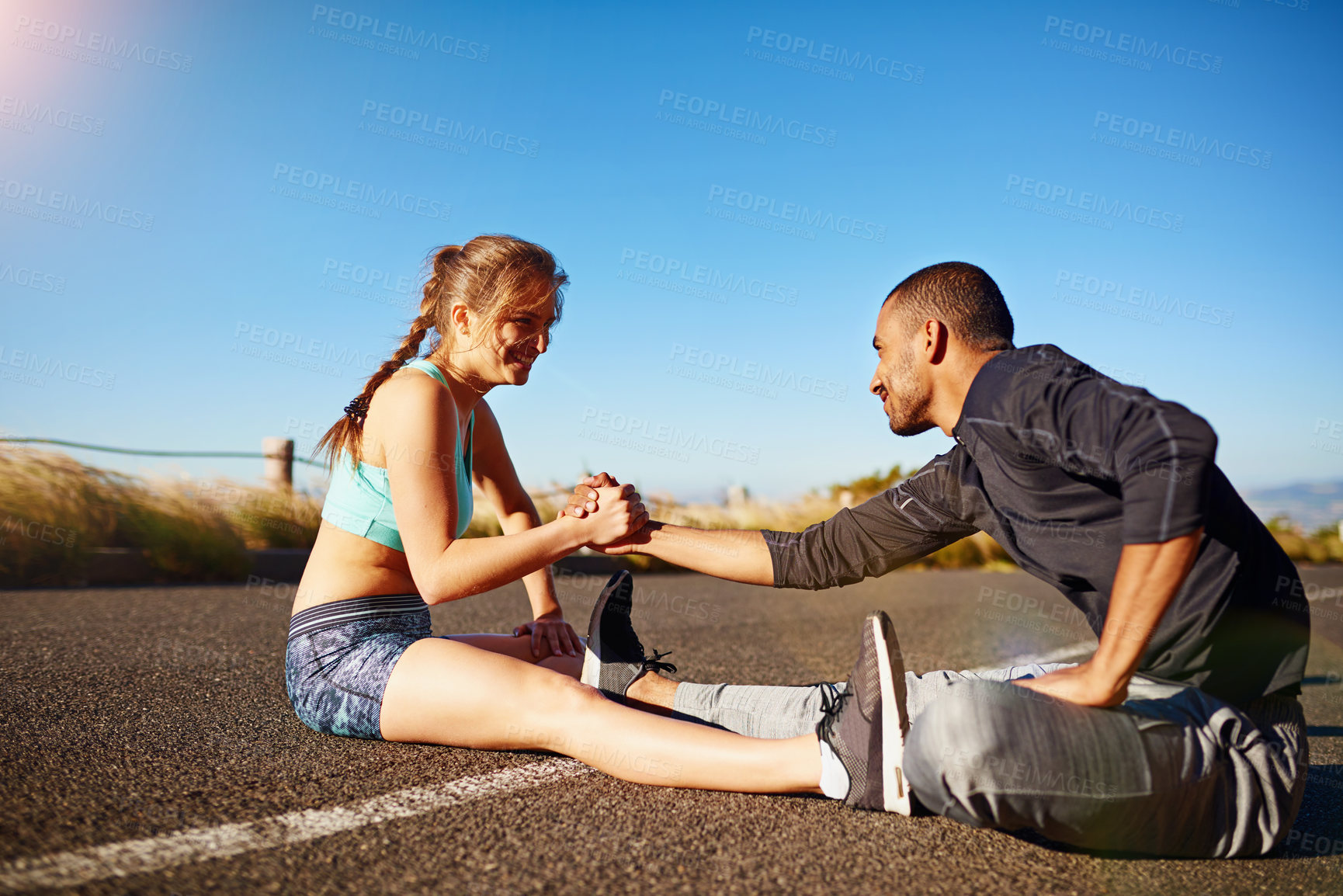 Buy stock photo Outdoor, exercise and couple with stretching on floor for sports, fitness or support in warm up. Nature, man and woman with hands together in flexibility for muscle strength, training or healthy body