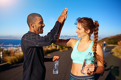 Buy stock photo High five, man and woman on mountain for exercise, teamwork and confidence in fitness training together. Smile, nature and personal trainer with athlete, celebration and success in outdoor workout