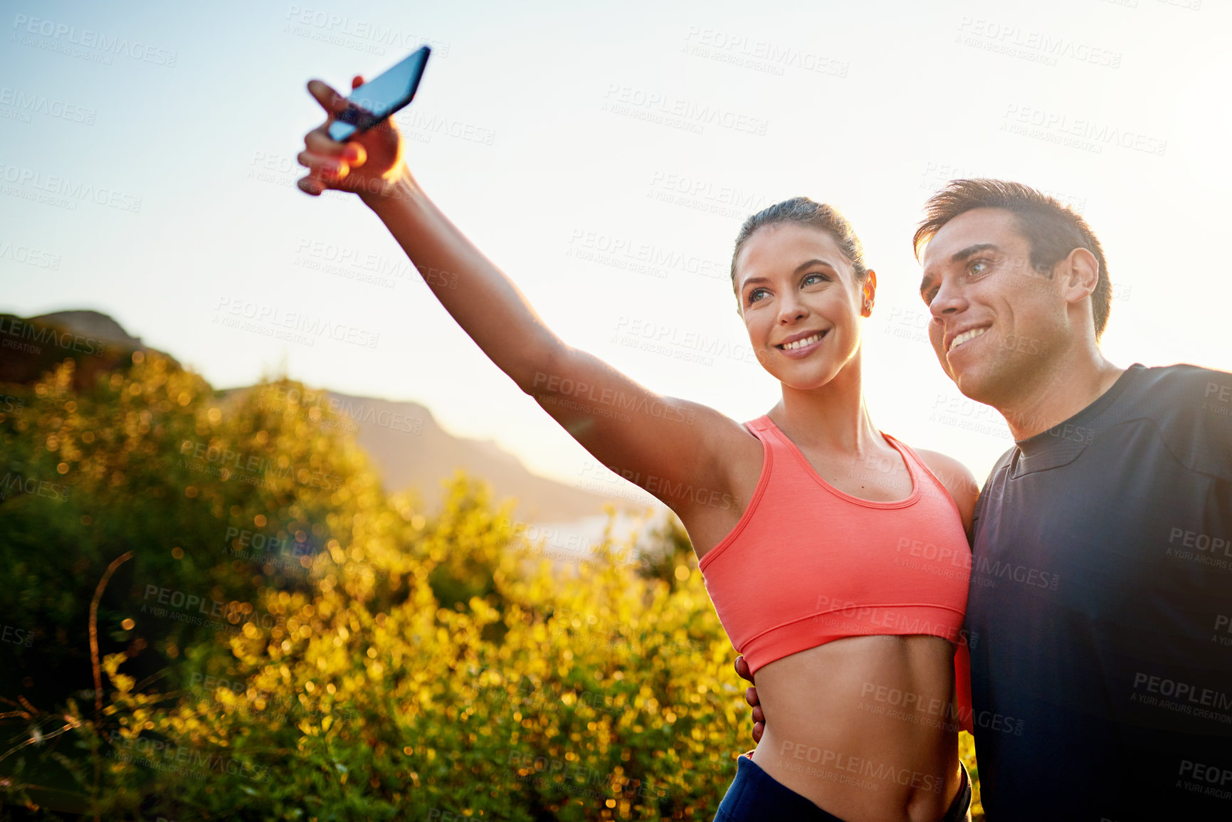 Buy stock photo Happy couple, fitness and fitness with selfie for workout, exercise or outdoor walk on mountain in nature. Active young man and woman with smile for picture, photography or memory on trekking journey