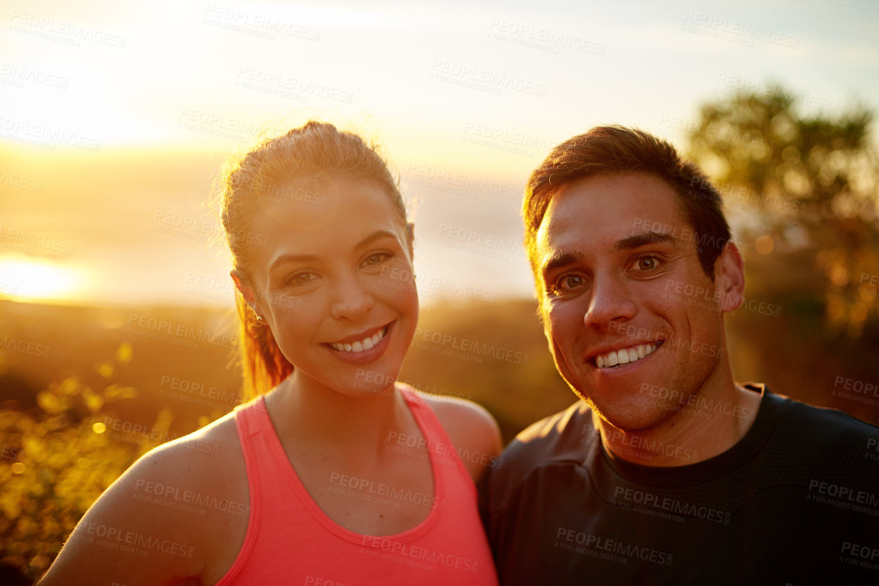 Buy stock photo Fitness, man and woman in portrait with sunset, support and confidence in outdoor training together. Morning exercise, runner and happy personal trainer couple in nature for workout challenge on hill