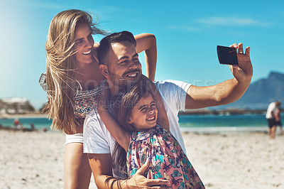 Buy stock photo Beach, selfie and parents with girl child for social media post, memory or photograph with blue sky. Travel, young kid and happy man with woman for adventure, holiday or weekend getaway in California