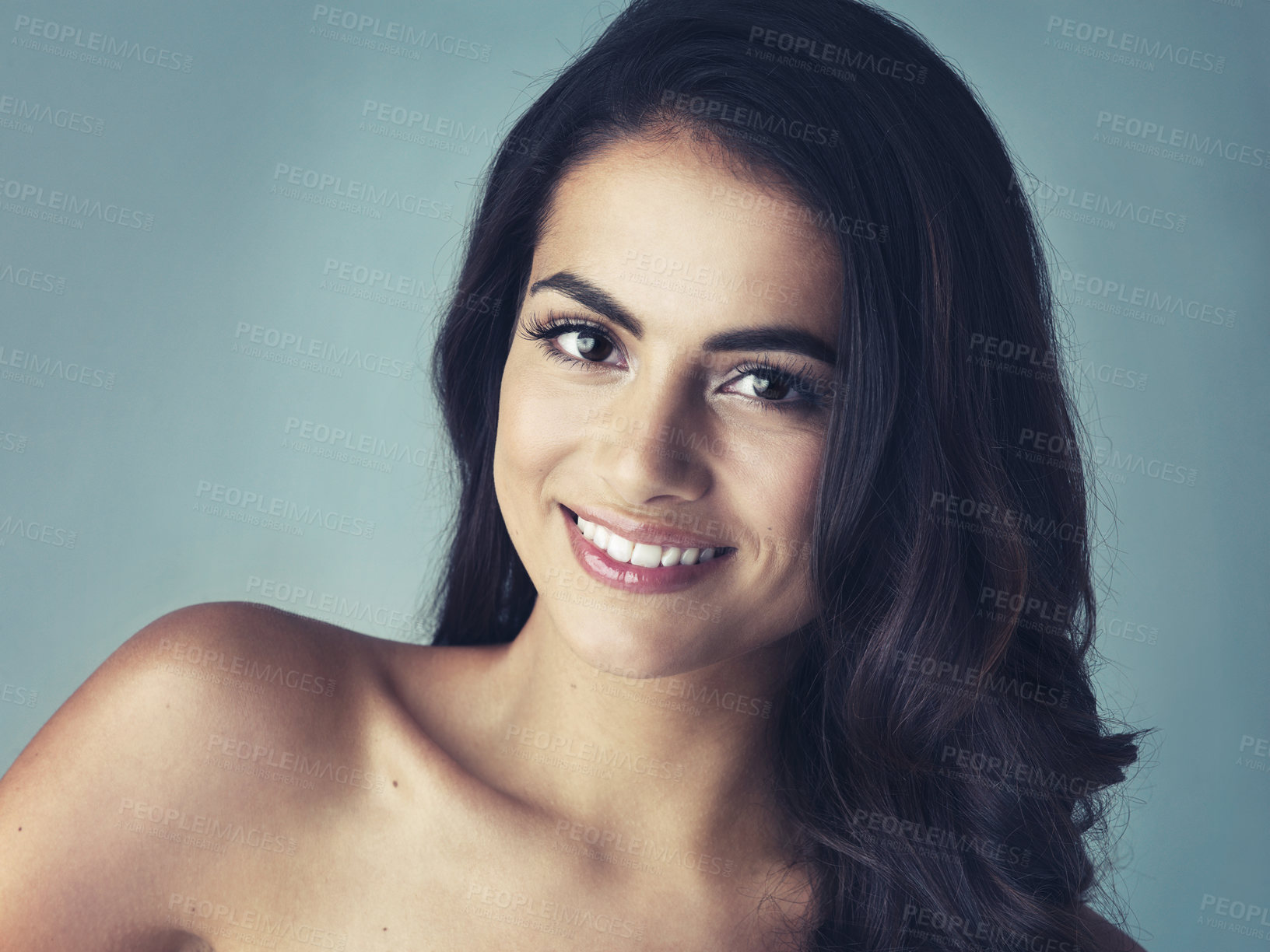 Buy stock photo Cropped shot of a beautiful young woman posing in the studio