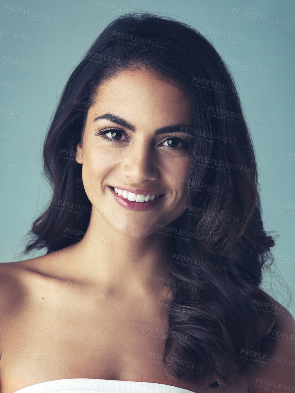 Buy stock photo Cropped shot of a beautiful young woman posing in the studio