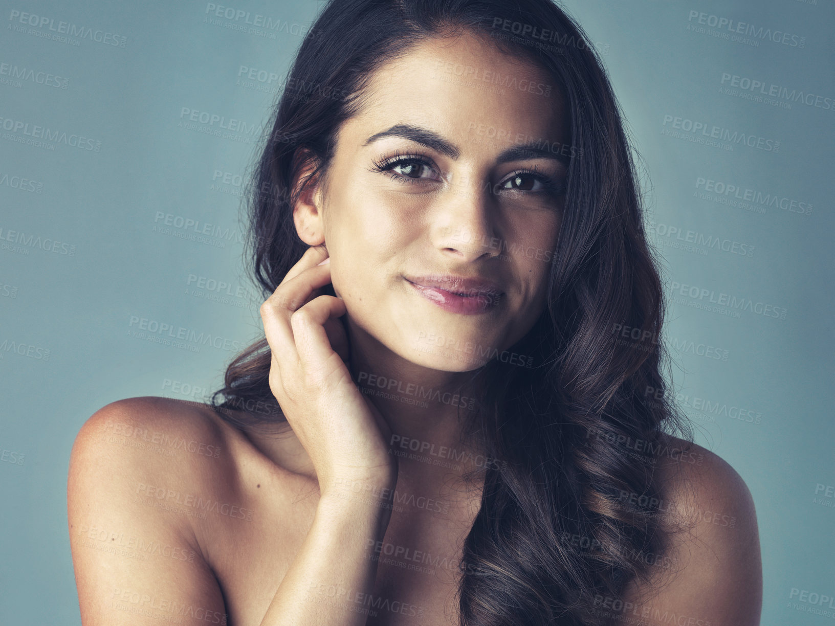 Buy stock photo Cropped shot of a beautiful young woman posing in the studio