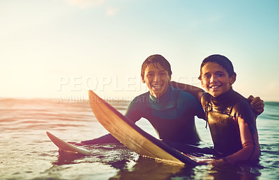 Buy stock photo Shot of two young boys out surfing