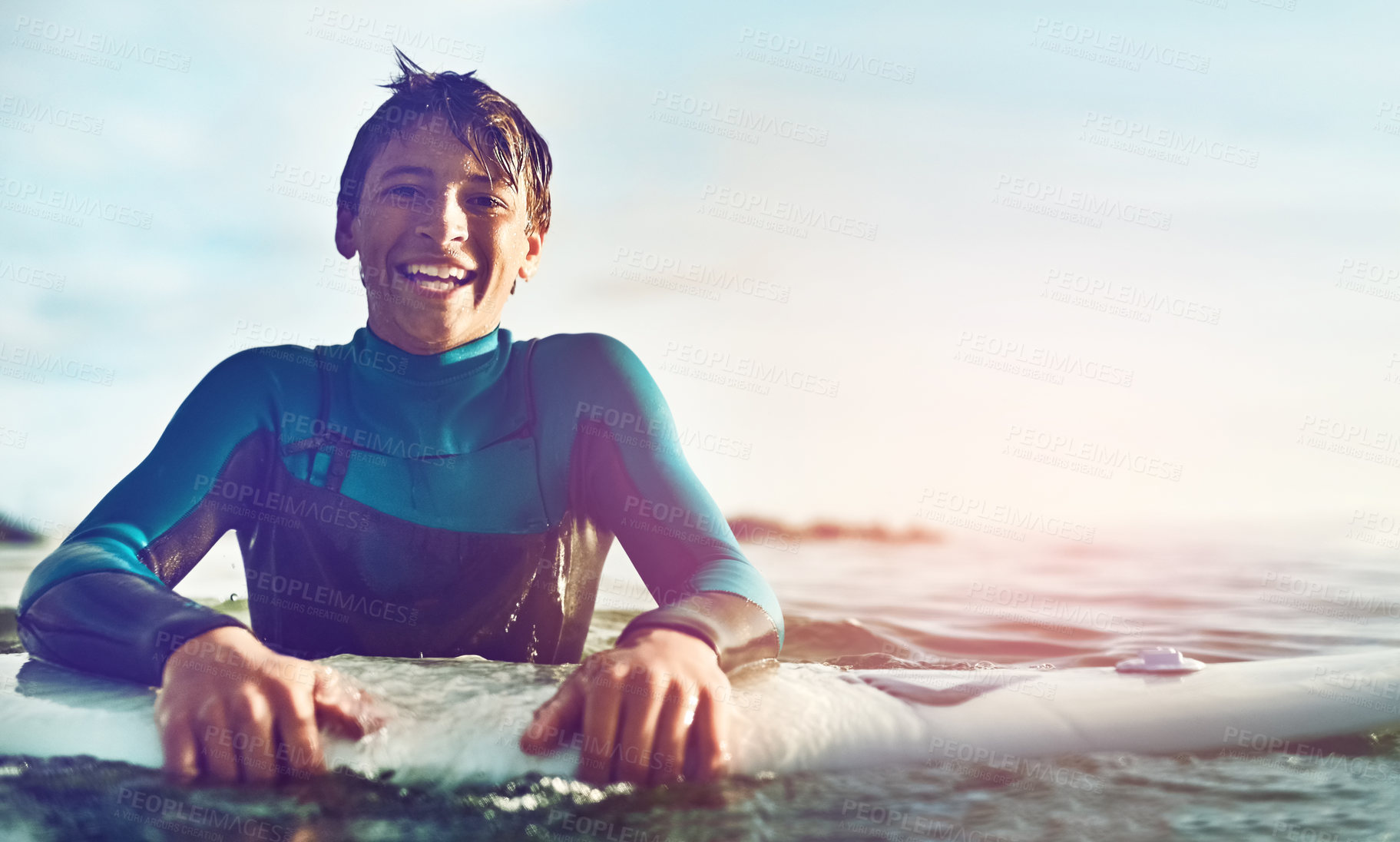 Buy stock photo Shot of a young boy out surfing