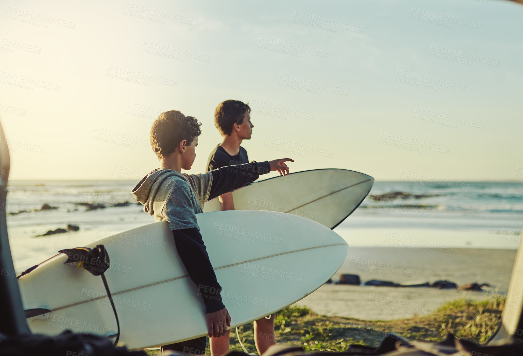 Buy stock photo Kid, learning and surf on beach with board for adventure on vacation, holiday or sport in water. Child, surfer and search the current in waves for safety on island in summer, nature or teens relax