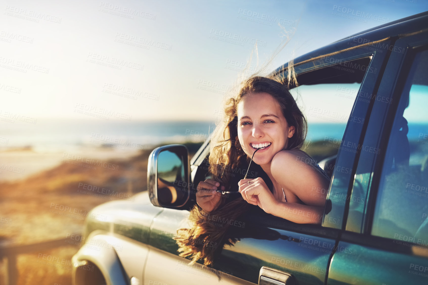 Buy stock photo Cropped portrait of an attractive young woman on a roadtrip