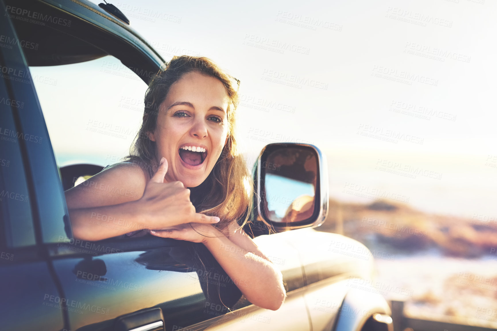 Buy stock photo Woman, portrait and travel with smile on road trip, transport window and vacation journey for adventure. Happy, female passenger and shaka hand sign for freedom, driving and holiday fun in outdoor