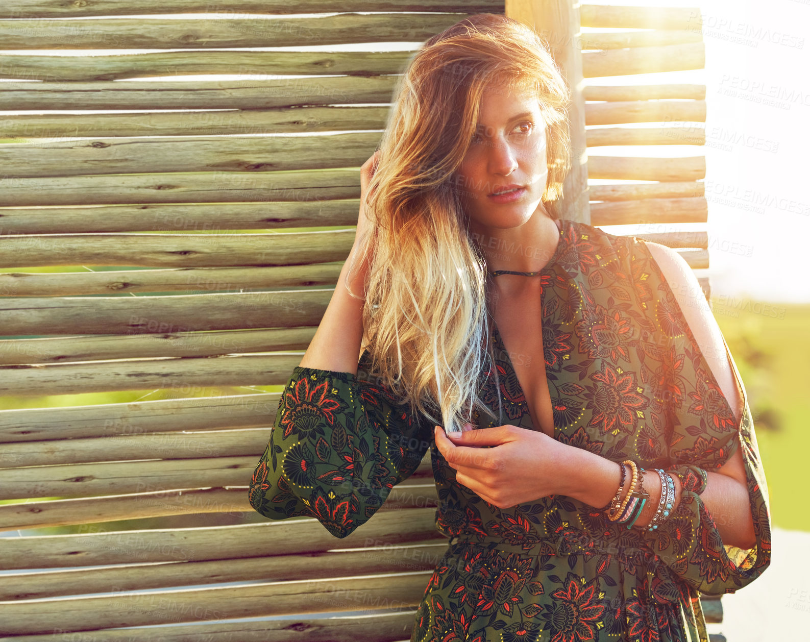 Buy stock photo Cropped shot of a fashionable young woman posing against a wooden partition