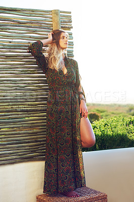 Buy stock photo Bohemian fashion, wall and woman with confidence, eco friendly or sustainable style outdoor. Boho dress, female person or pose for dream, vision or thinking of trendy or organic clothes at wood fence