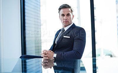 Buy stock photo portrait of a successful businessman sitting at his desk in an office