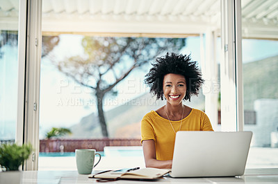 Buy stock photo Cropped portrait of an attractive young woman working on her laptop at home