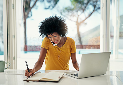 Buy stock photo Cropped shot of a young woman working in a panic at home on her laptop