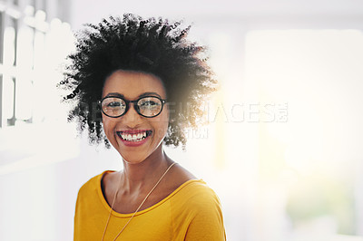 Buy stock photo Cropped portrait of an attractive young woman chilling at home on the weekend