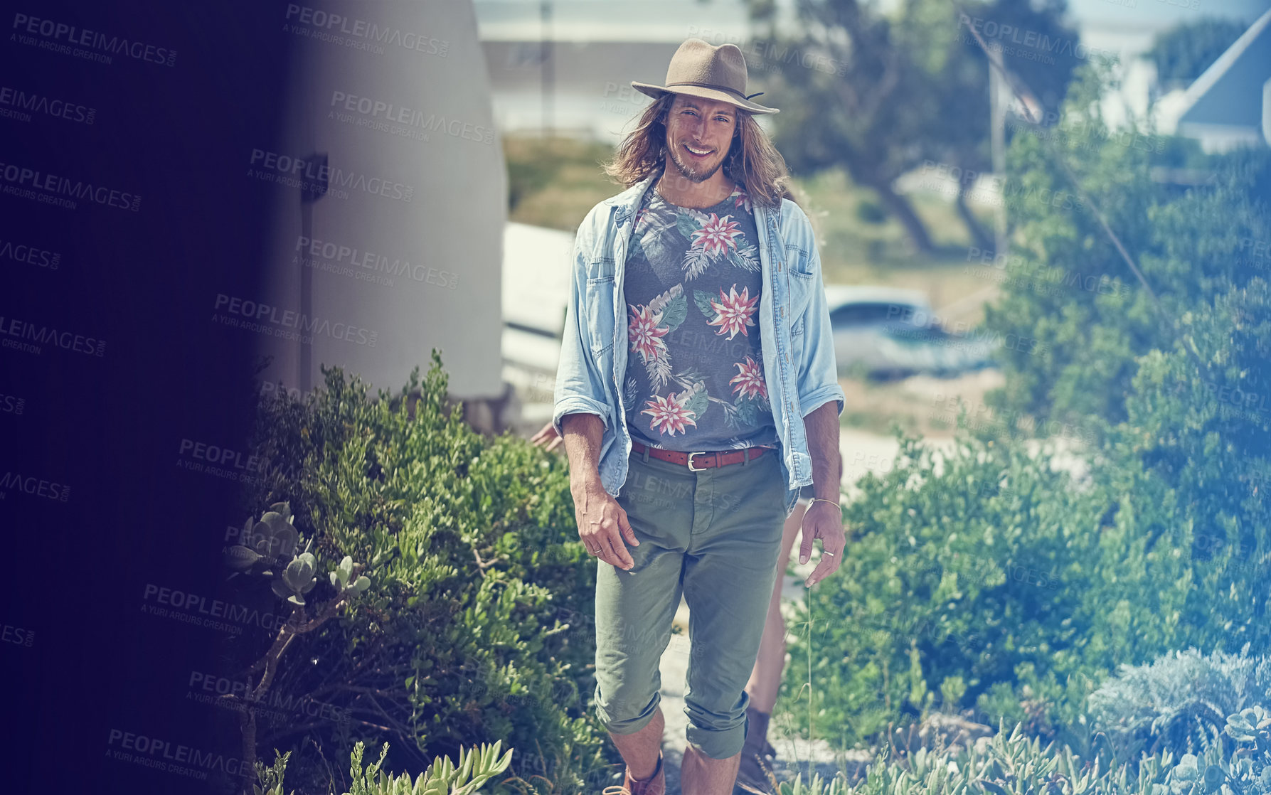 Buy stock photo Outdoor, road trip and happy man with vacation, portrait and confidence with town. Weekend break, hipster and guy with nature, journey and environment with summer holiday and countryside with hat