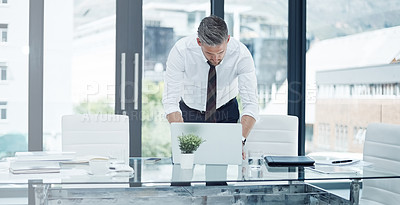 Buy stock photo Shot of a corporate businessman working in an office