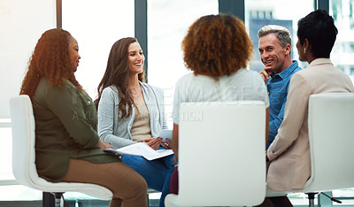 Buy stock photo Shot of a team of colleagues having a meeting in a modern office