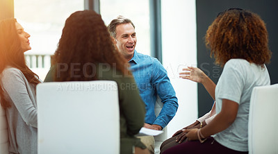Buy stock photo Shot of a team of colleagues having a meeting in a modern office