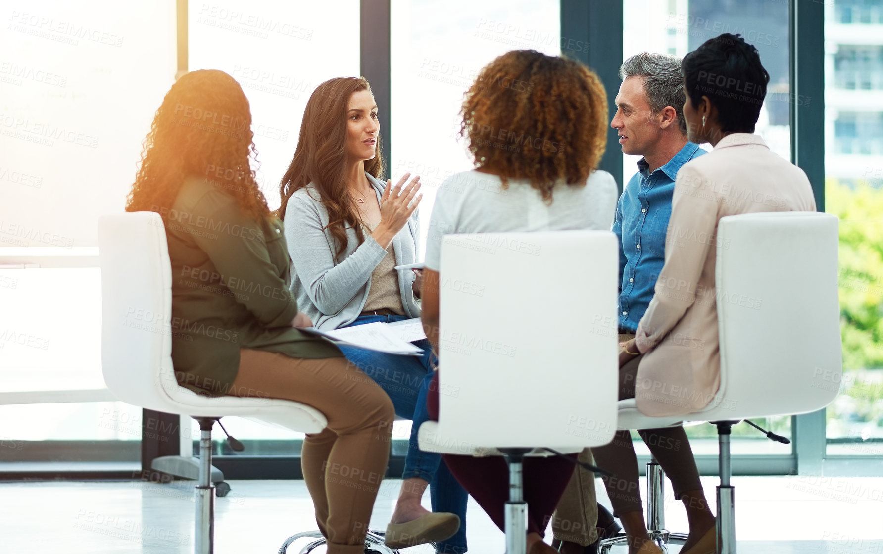 Buy stock photo Shot of a team of colleagues having a meeting in a modern office