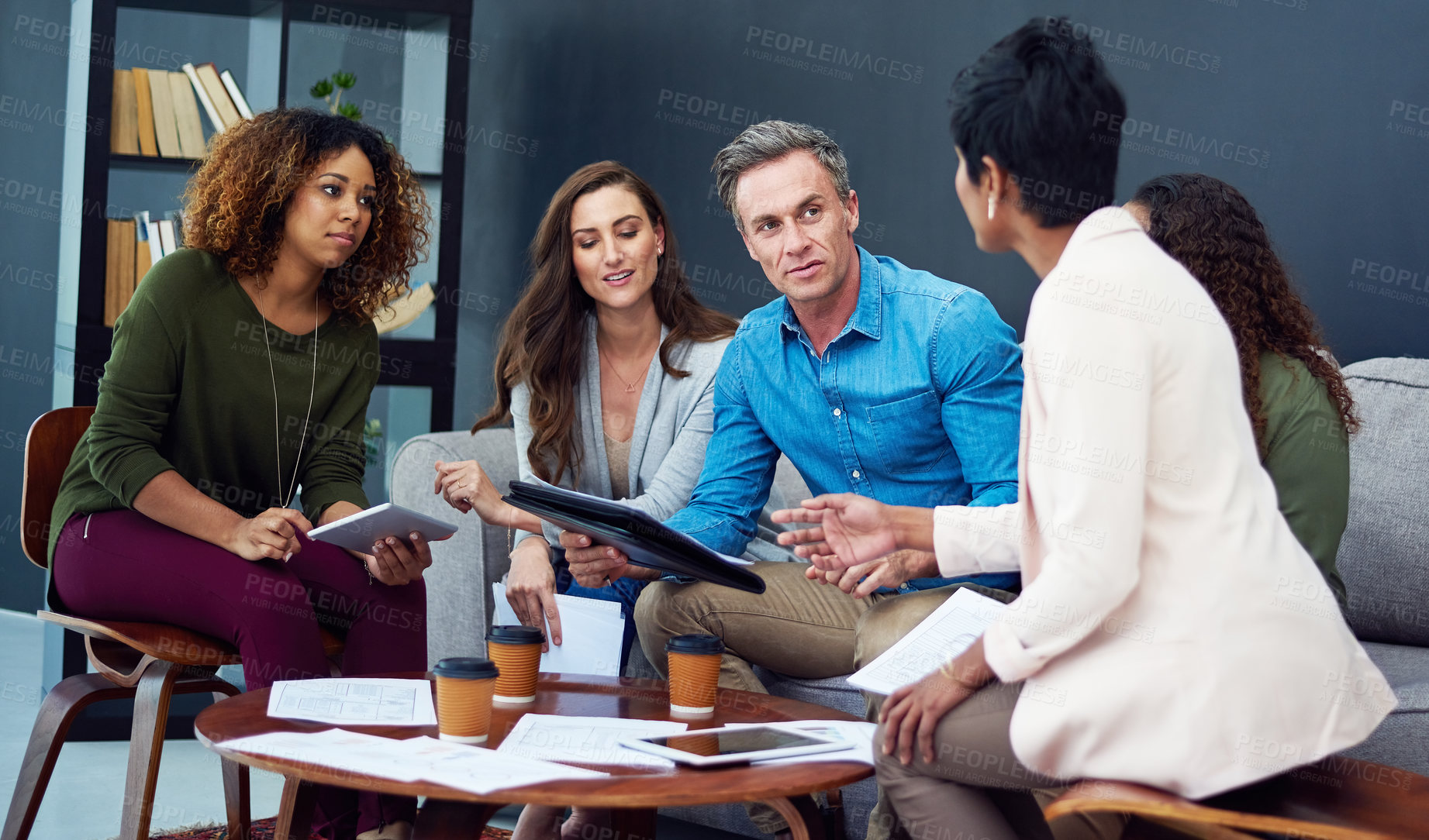 Buy stock photo Shot of a creative team meeting in the office