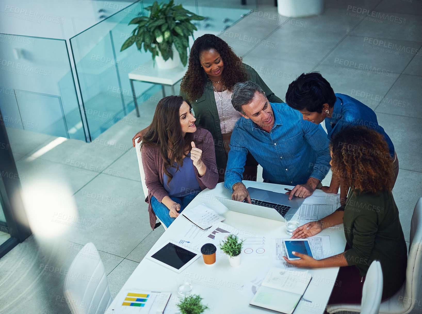 Buy stock photo Infographic, laptop and meeting with business people in office together for collaboration. Charts, data and technology with social media team at work for discussion or project management from above