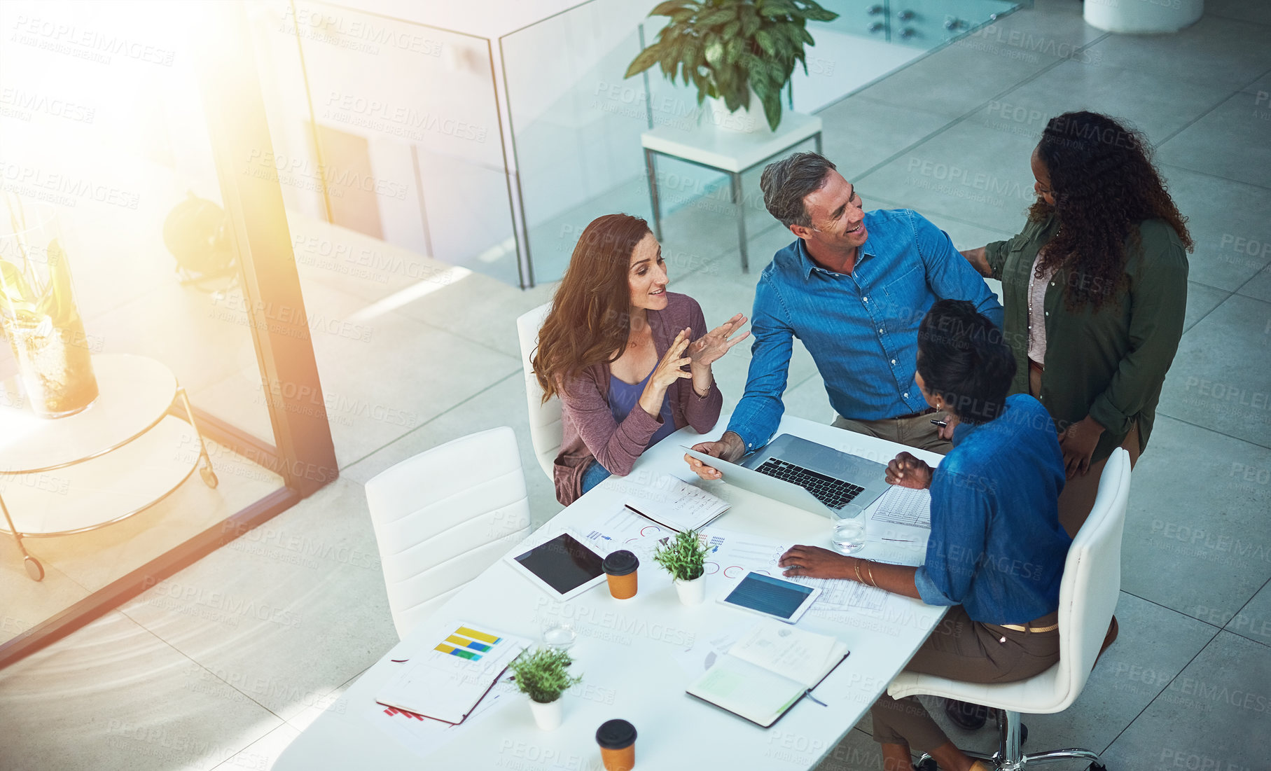 Buy stock photo High angle shot of a group of designers having a meeting in an office