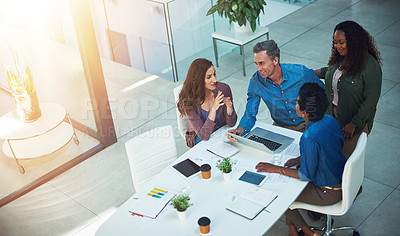 Buy stock photo High angle shot of a group of designers having a meeting in an office