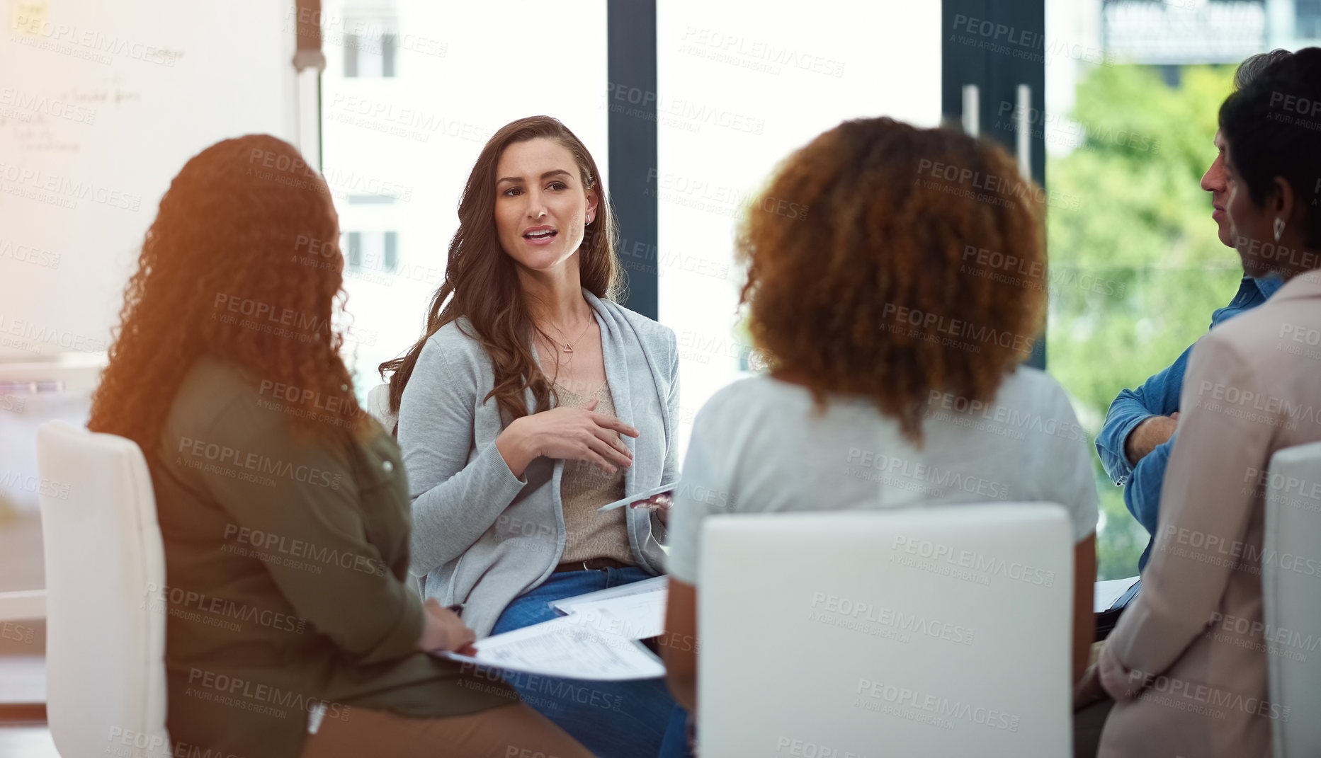 Buy stock photo Shot of a team of colleagues having a meeting in a modern office