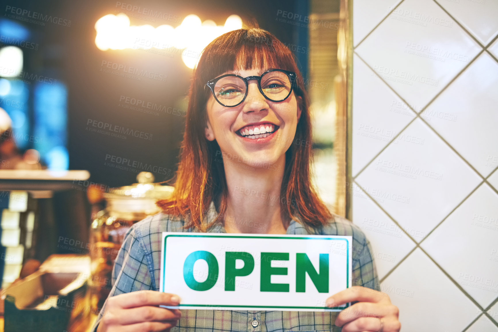 Buy stock photo Portrait of a young business owner holding an 