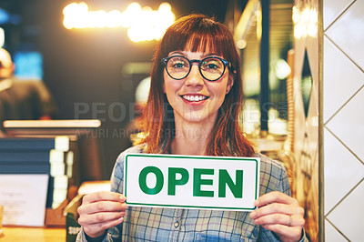 Buy stock photo Portrait of a young business owner holding an 