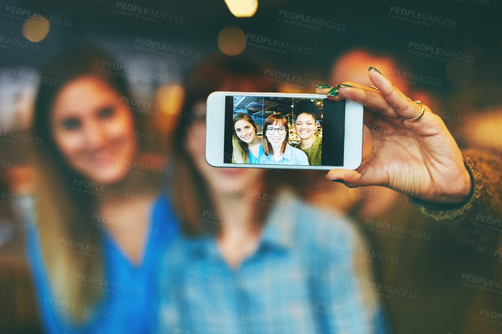Buy stock photo Phone screen, women and selfie of friends in cafe for happy memory, social media or profile picture. Mobile display, photo and girls together with hand in restaurant with bokeh, online post or smile