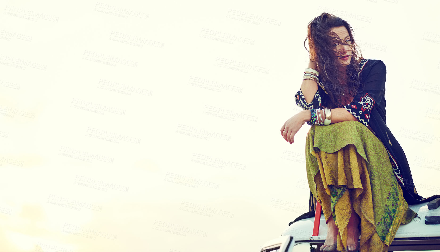 Buy stock photo Shot of a young woman stopping at the beach during a roadtrip