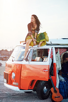 Buy stock photo Shot of a young woman stopping at the beach during a roadtrip