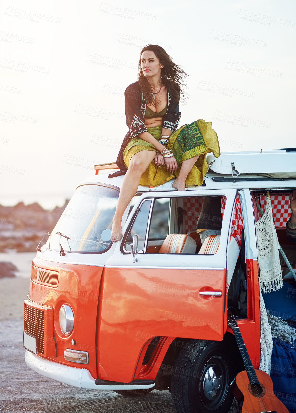 Buy stock photo Shot of a young woman stopping at the beach during a roadtrip